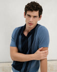 Man wearing a blue striped shirt against a light background
